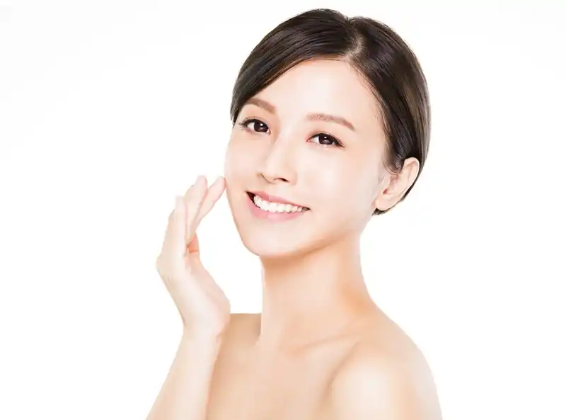 closeup young woman smiling face with clean skin